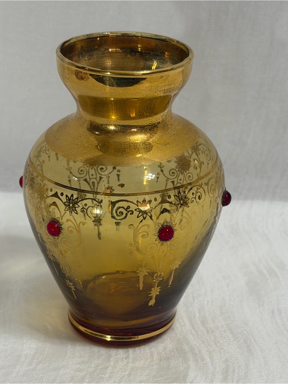 Vecchia Murano vintage amber glass vase with 24K gold trim and red cones.